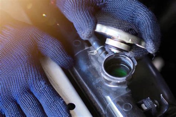 Can a loose radiator cap cause overheating?